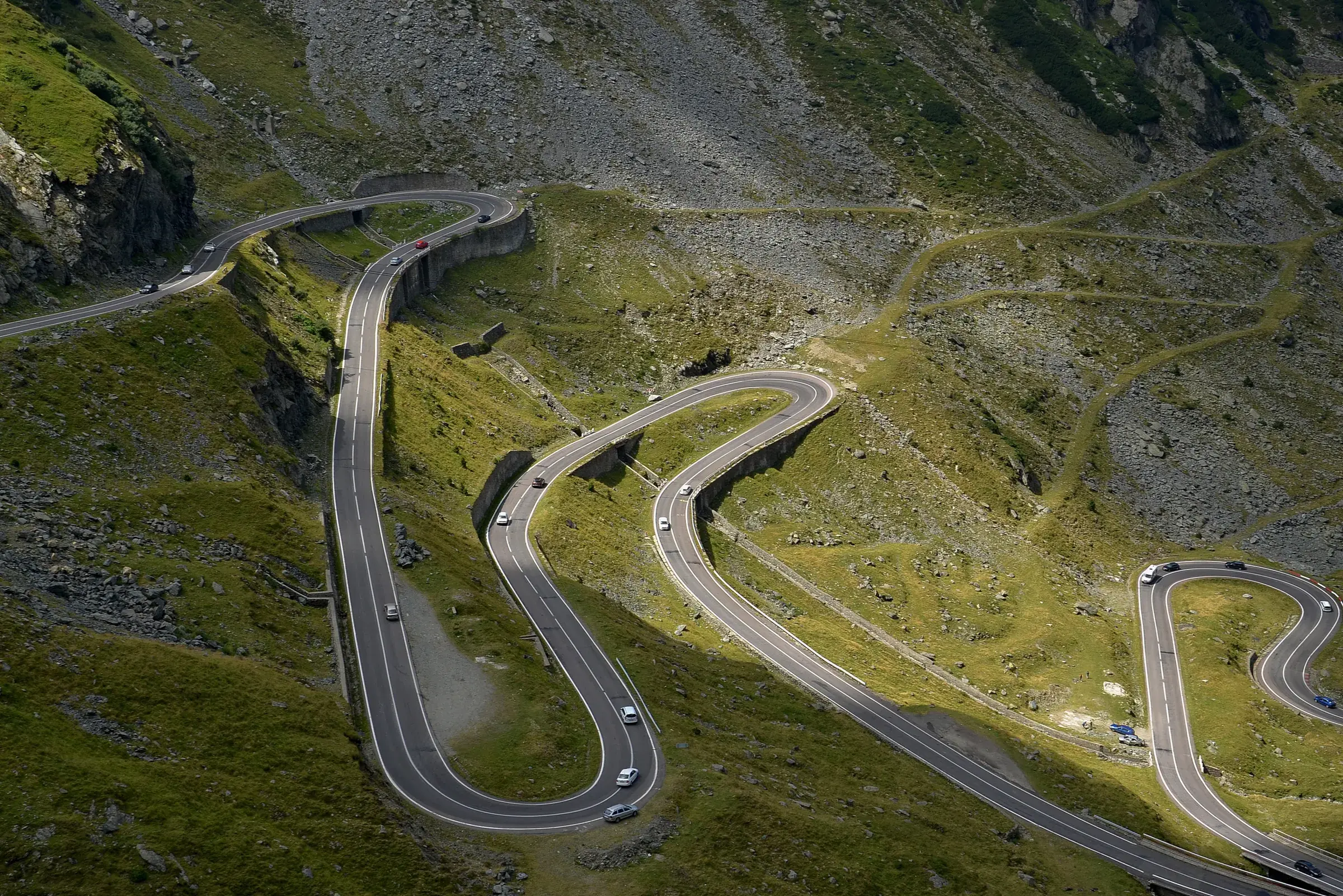 Hairpin bends of the Transfăgărășan road winding up the mountain